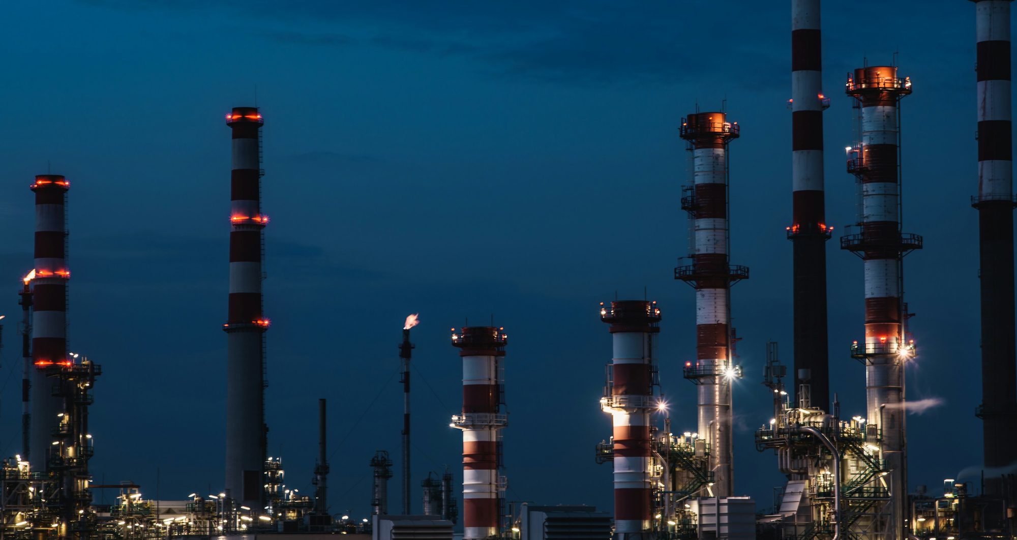 Refinery towers at dusk