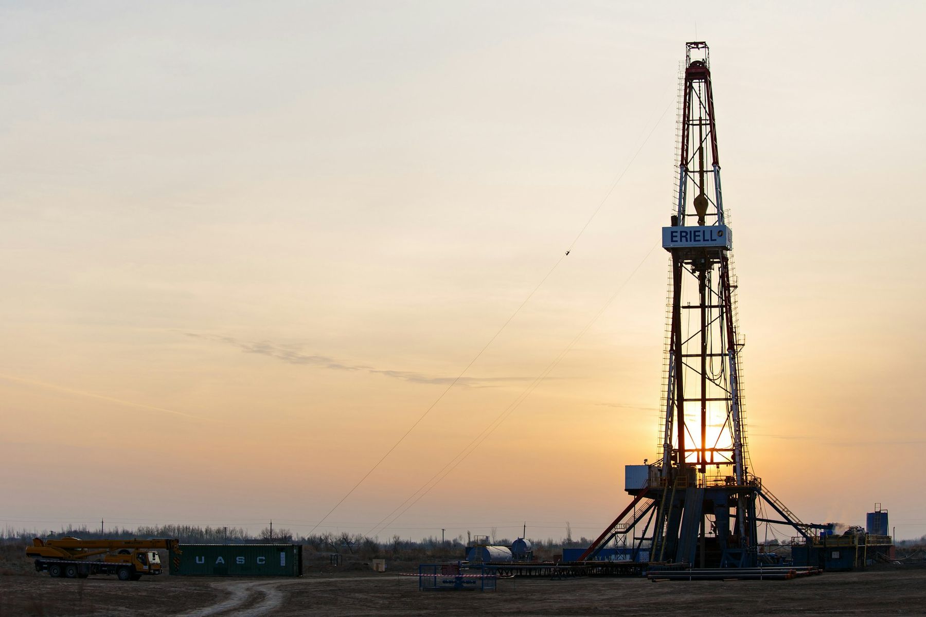 Drilling rig at sunset